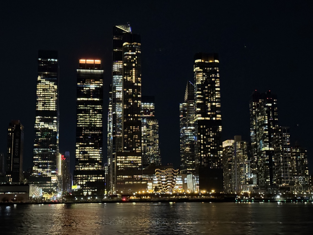 Manhattan by night from a boat on the river